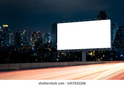 Billboard Mockup Outdoors, Outdoor Advertising Poster At Night Time With Street Light Line For Advertisement Street City Night. With Clipping Path On Screen.