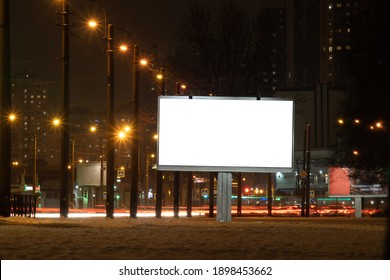 Billboard Mockup Outdoors. Outdoor Advertising Poster At Night Time With Street Light For Advertisement Street City Night. With Clipping Path On Screen.