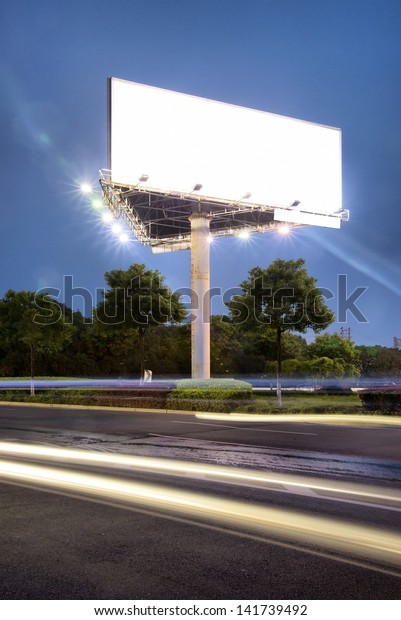 Billboard at night light\
trails