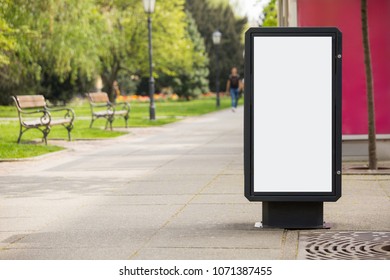 Billboard For Outdoor Advertising On A City Street. White Screen, You Can Insert Your Picture Here.