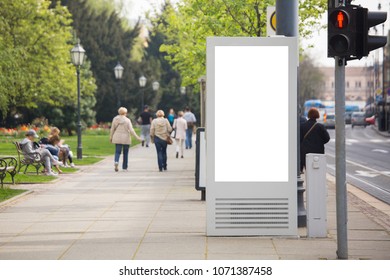 Billboard For Outdoor Advertising On A City Street. White Screen, You Can Insert Your Picture Here.