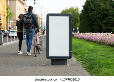 Billboard For Outdoor Advertising On A City Street. White Screen, You Can Insert Your Picture Here.