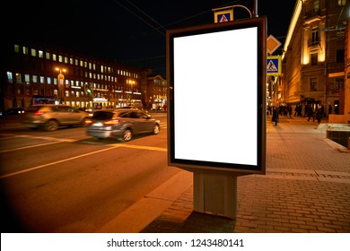 Billboard Outdoor Advertising on the street glows at night. Layout for advertising design. Outdoor Digital Sheet pylon with a white field.