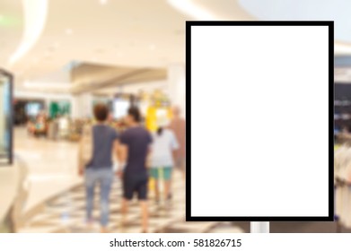 Billboard For Store Front, Advertising Poster Sign And Blurred People In The Shopping Mall As Background, Mock Up For Display Of Product.