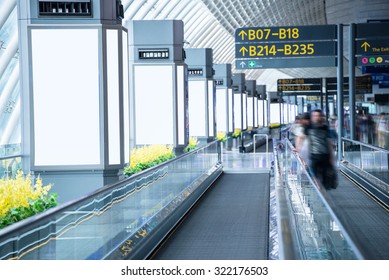 Billboards Beside The Moving Sidewalk