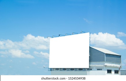 ฺBillboard,Large Billboards And Sky,A Large White Billboard On The Back Of The Building