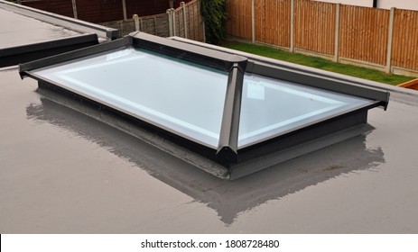 Billericay, Essex, United Kingdom, August 11, 2020. Grey Flat Roof Window Or Light / Lantern. Wet Day With Reflections In The Rain. New Build House. Billericay, Essex, United Kingdom,  August 11, 2020