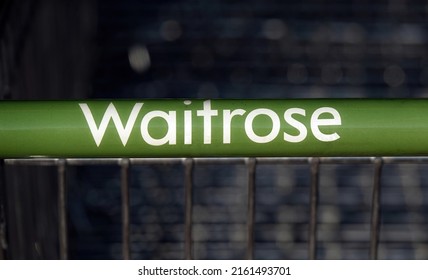 BillerIcay, UK - March 20, 2022: A Close-up Of A Waitrose Supermarket Shopping Trolley Handle.