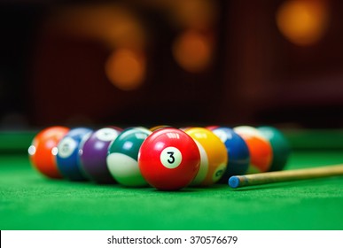 Billiard balls in a green pool table, game - Powered by Shutterstock