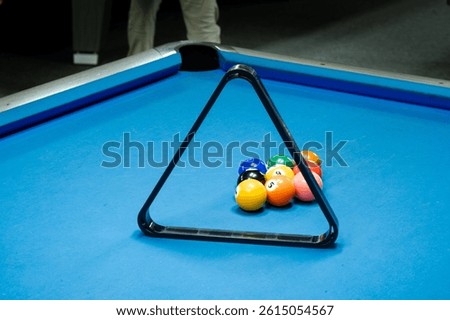Billiard Balls Lined Up with a Triangle Rack on a Professional Pool Table
