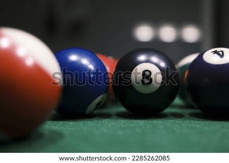 Billiard balls on a green billiard table. Selective focus.
