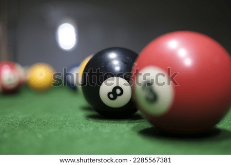 Billiard balls on a green billiard table. Selective focus.