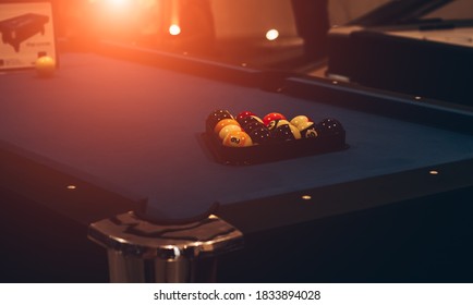 Billiard balls in a pool table.