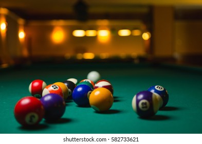 Billiard balls in a pool table.