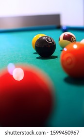 Billiard Black Ball Figure Eight On Green Table. Vertical Image