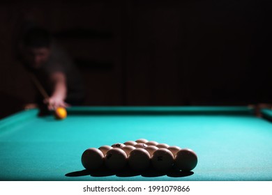 Billiard club. Gambling table with russian billiard set and dark cue ball. Russian pyramid (Russian billiard, pyramid billiards), sport. - Shutterstock ID 1991079866