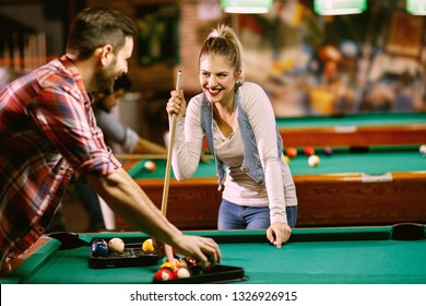 billiard - Couple enjoying while playing billiard in bar