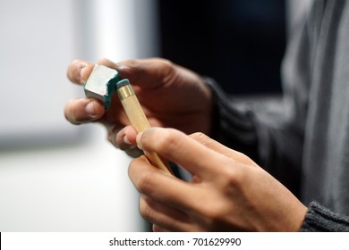 Billiard player rubs chalk his cue. Details of the game of billiards. Low light by intention - Shutterstock ID 701629990