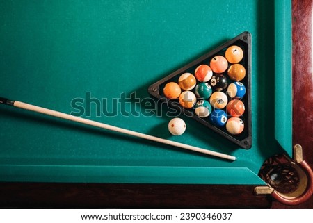 Billiard table with green surface and balls in the billiard club.Pool Game.