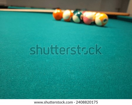 Billiard table with queue and balls 