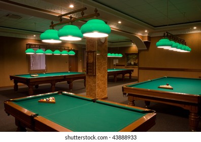 billiard tables in empty room
