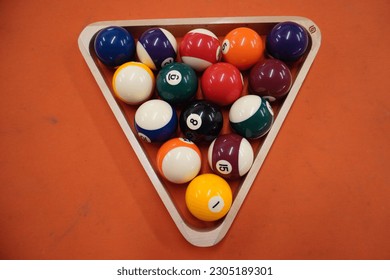 Billiards is a cue sport played on a table with balls, where players use cues to strike the balls into the pockets. It requires skill, strategy, and precise shot-making to win.
