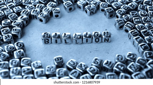 Billion - Word From Metal Blocks On Paper - Concept Photo On Table
