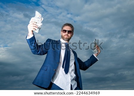 billionaire man with money outside. billionaire man with money in suit. photo of billionaire man