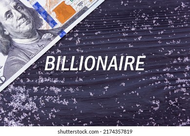 BILLIONAIRE - Word (text) On A Dark Wooden Background, Money, Dollars And Snow. Business Concept (copy Space).