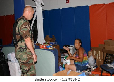 BILOXI, UNITED STATES - Sep 06, 2005: Air Force Journalist Interviews Hurricane Katrina Survivor At Shelter.