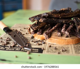 Biltong (dried meat) being cut