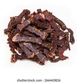 Biltong South African beef jerky isolated on a white studio background.