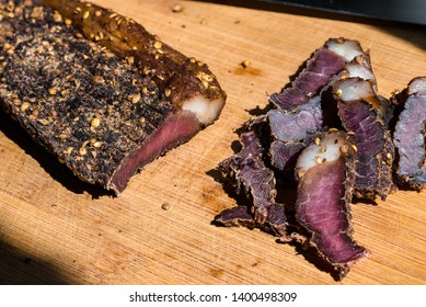 Biltong - Traditional South African Jerky made from beef or game meat, cured and dried with salt and spices; eaten uncooked, often as a snack.