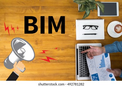 BIM Businessman Working At Office Desk And Using Computer And Objects, Coffee, Top View