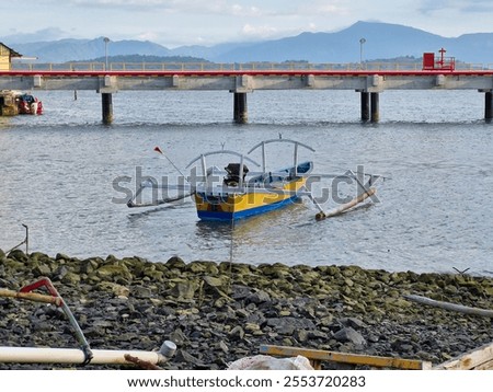 Similar – Image, Stock Photo Yellow fishing boat moored in ocean turquoise water