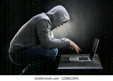 binary code on the background of a man squatting on a chair and looking into a laptop, the concept of a mad programmer