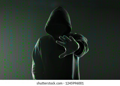 Binary Code On The Background Of The Silhouette Of A Hacker In The Hood, The Concept Of Stop Cyber Attack