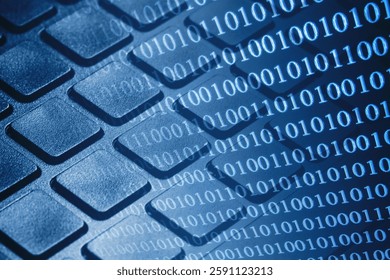 Binary code overlay on a computer keyboard. Digital technology and cybersecurity concept. Data flow background. Internet communication texture. Software coding in a modern business environment.