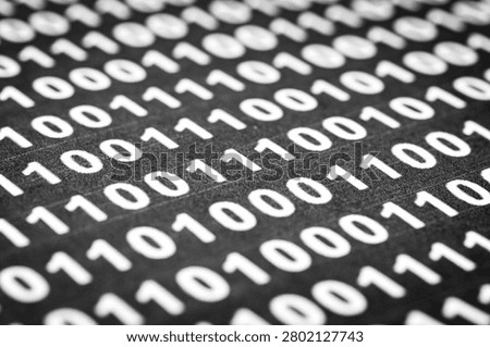 Binary code pattern on black surface for technology background