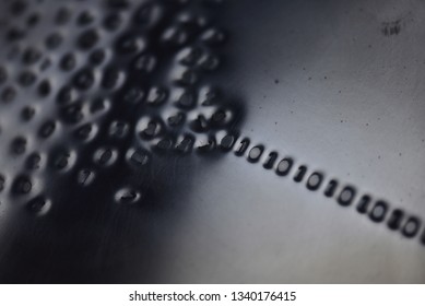 Binary code: stylistic images depicting digital language emerging from a numerical cloud with intentional focus issues
