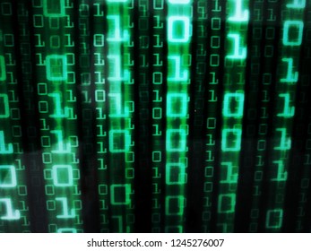 binary data matrix on black colour computer screen display. full frame photo of code on monitor. retro style company data sign for digital concept.