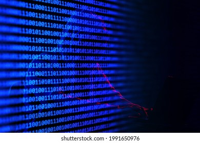 Binary laptop on colored studio background