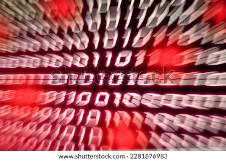 Binary number stream code blurred with zoom effect representing information technology computers network - red danger hacked virus