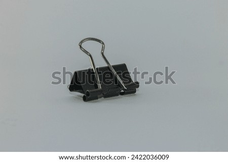 Binder clips are used to clamp paper