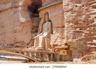 Bingling si shiku, Gansu / China - April 27, 2017: Side view on Buddha statue at the Bingling grottoes. The grottoes were created around 420 AD. - Shutterstock ID 1790300567
