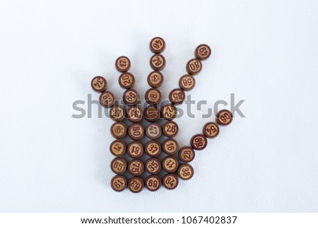 Bingo balls forming a handbreadth 