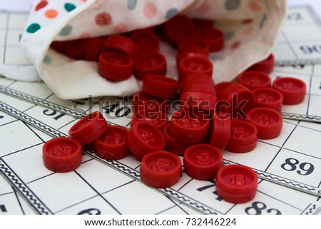 Bingo cards with chips closeup with pouch