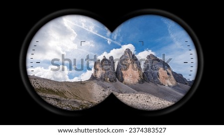 Binoculars point of view with the mountain peaks of the Drei Zinnen or Tre Cime di Lavaredo (three peaks of Lavaredo), Italian Alps. Sesto Dolomites, Trentino-Alto Adige and Veneto, Italy, Europe.