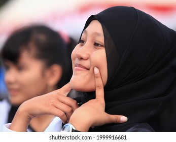 Bintan, Indonesia - November 9, 2012 : A Girl Smiles Sweetly When She Is Practicing A Traditional Dance From The Malay Culture Of The Riau Archipelago.