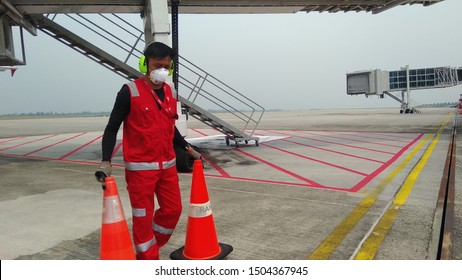 Bintulu Sarawak Malaysia - September 15 2019 : Haze 'very Unhealthy' Air Quality In Sarawak,Ground Team Red Staff At Bintulu Airport Wearing 3M Facemask For Extra Protection. 